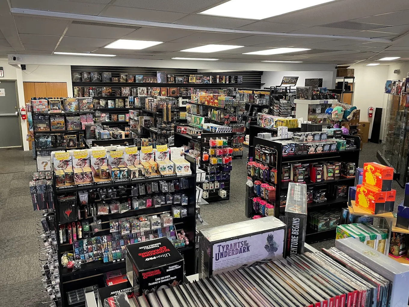 Rows of games, cards, and collectables inside Jester's Gallery