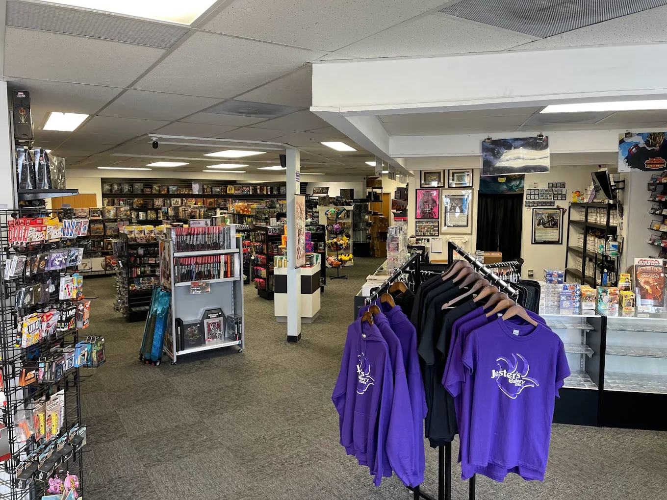 Inside Jester's Gallery — aisles, counter, and apparel